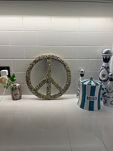 Medium gold glitter, sequin and resin peace sign.