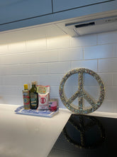 Medium gold glitter, sequin and resin peace sign.