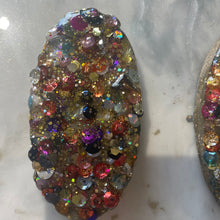 Large gold glitter and sequin eyes and mouth.