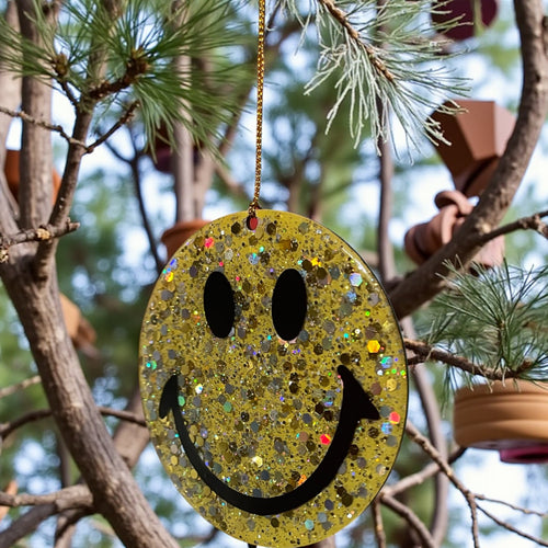 Yellow super glitter smiley face Christmas decoration.