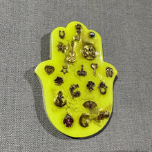 Small neon yellow hamsa hand with gold miligros charms.