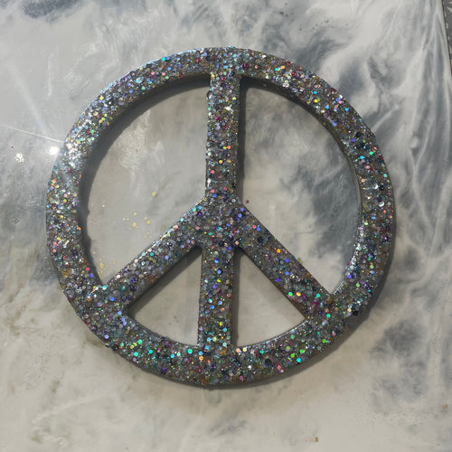 Medium gold glitter, sequin and resin peace sign.