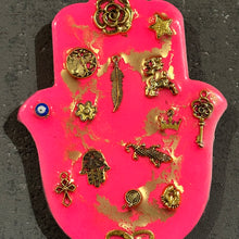 Small neon pink hamsa hand with gold miligros charms.