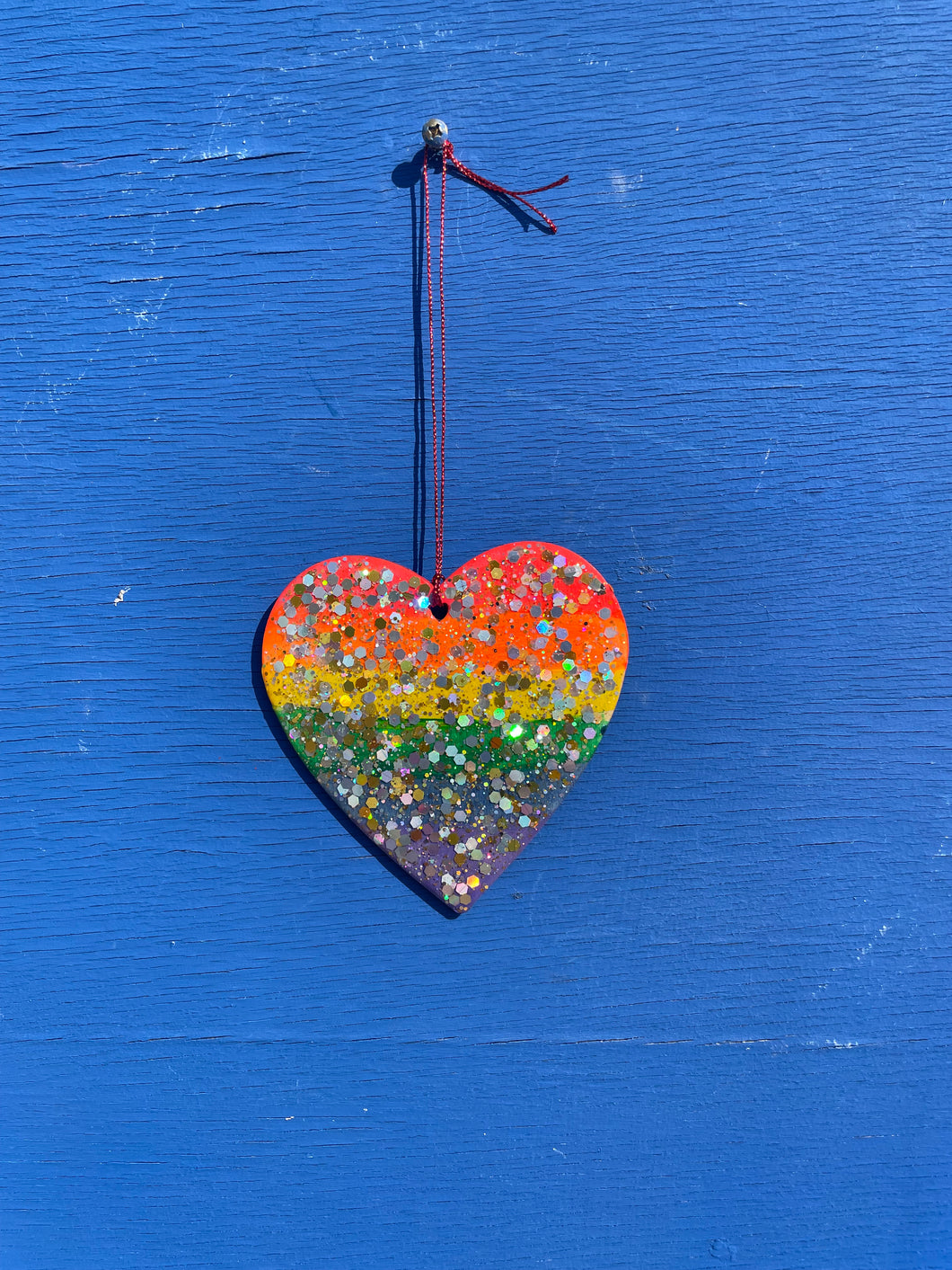 Rainbow glitter hanging heart.