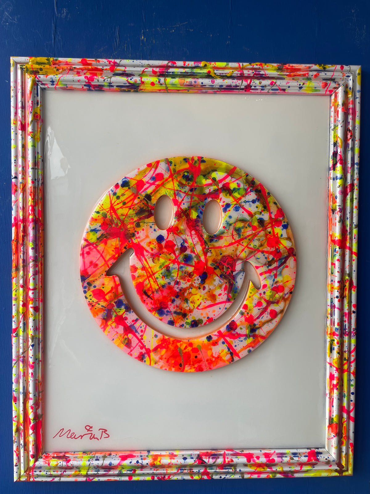 Framed resin splatter smiley