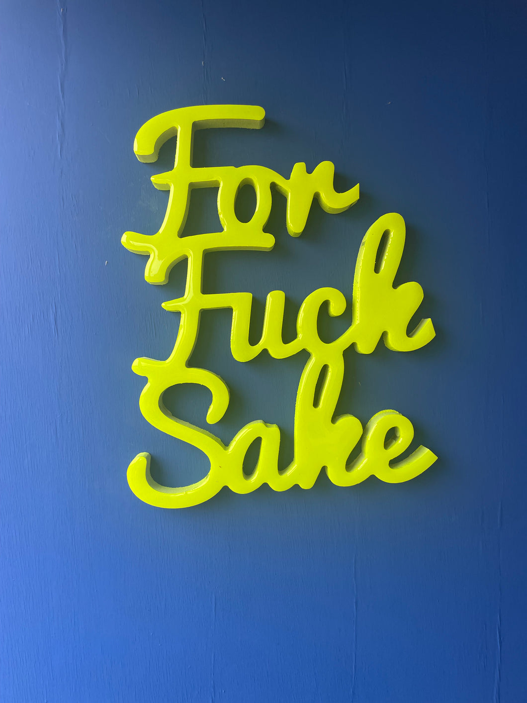 Large ffs statement sign in glow in the dark neon yellow.