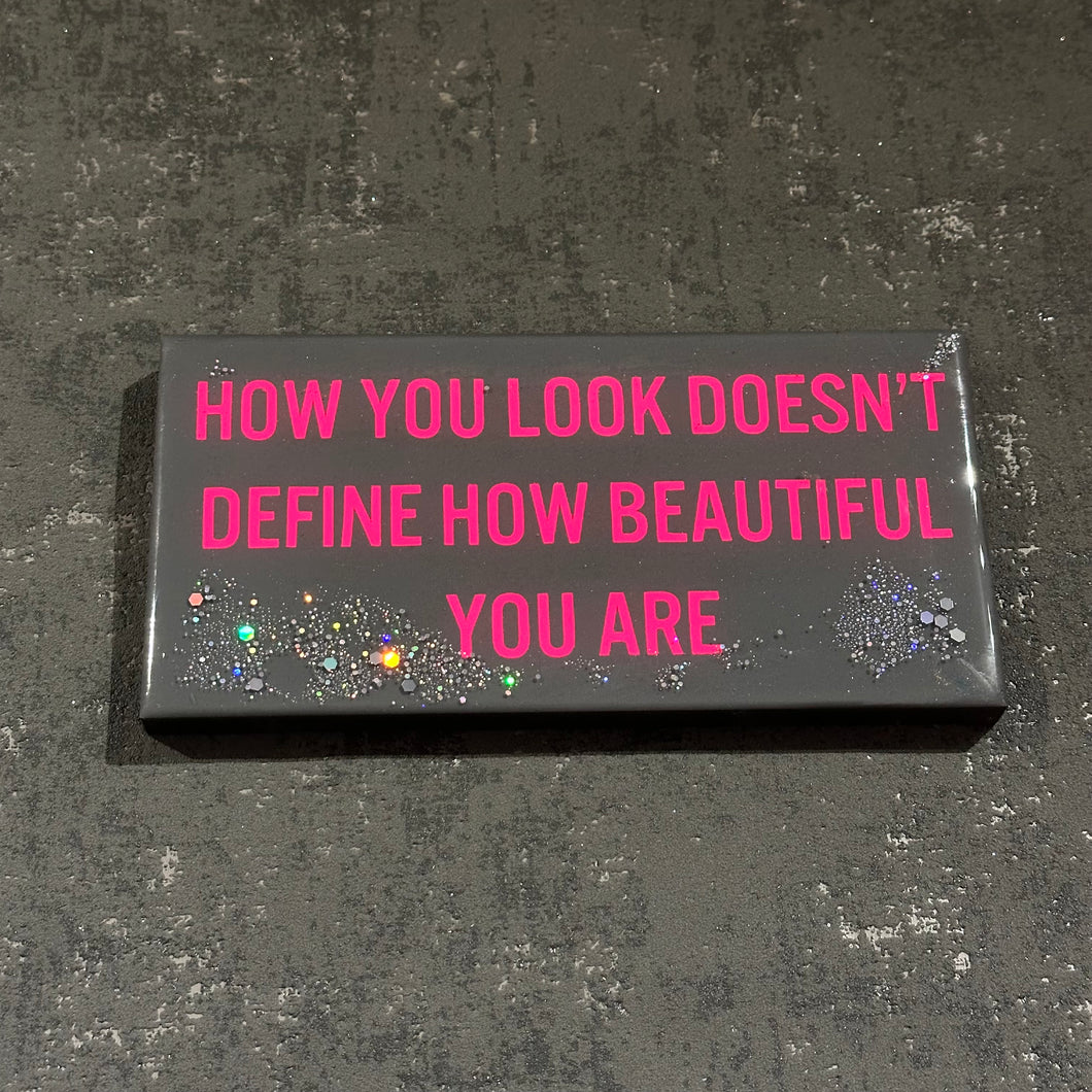 How you look doesn't define how beautiful you are plaque in grey and hot pink