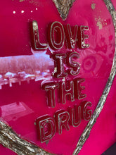 LOVE IS THE DRUG, resin art work.