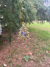 Gold glitter and sequin tree Christmas tree decoration.
