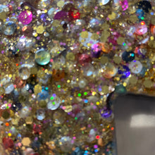Medium gold sequin glitter and resin cross.