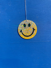 Yellow glitter hanging smiley face.