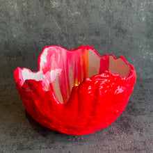 Large hatched in hot pink, white and orange