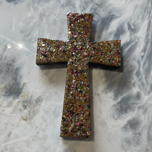 Medium gold sequin glitter and resin cross.